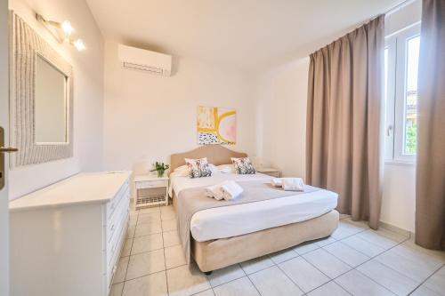Postel nebo postele na pokoji v ubytování Front Lake Apartment Bardolino
