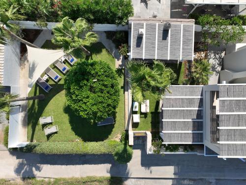 an overhead view of a park with benches and trees at Sea La Vie in Adelianos Kampos