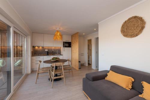 a living room with a couch and a table at wecamp Reserva Alecrim in Santiago do Cacém