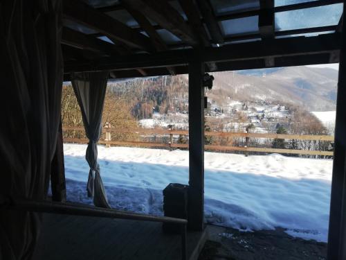 a view from the window of a room with snow at Chata z Widokiem in Międzybrodzie Bialskie