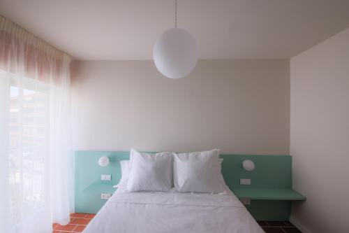 Letto o letti in una camera di Terra Aurea Aparthotel
