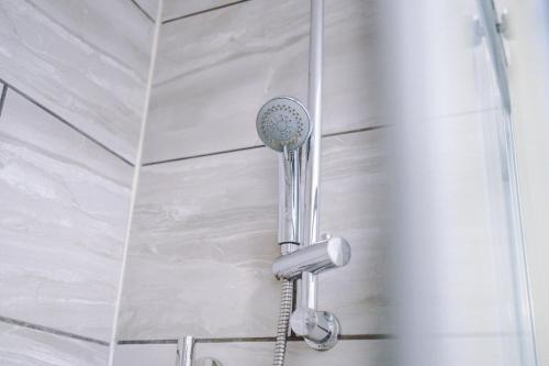 a shower with a blow dryer in a bathroom at Harley House in Parkside