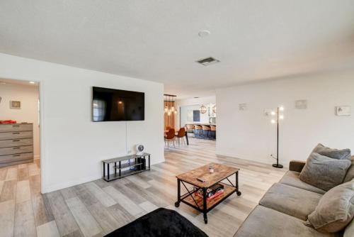 a living room with a couch and a table at Boynton 3 2 Pool House in Boynton Beach