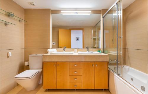 a bathroom with a sink and a toilet and a shower at Lovely Apartment In Mlaga With Kitchenette in Málaga