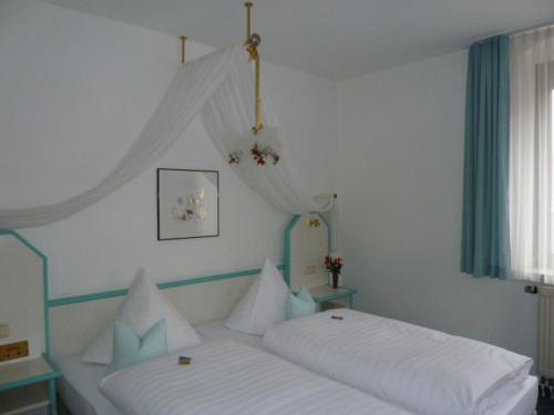 מיטה או מיטות בחדר ב-Haus Gaia