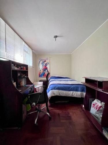 Una cama o camas en una habitación de Siempre Listo