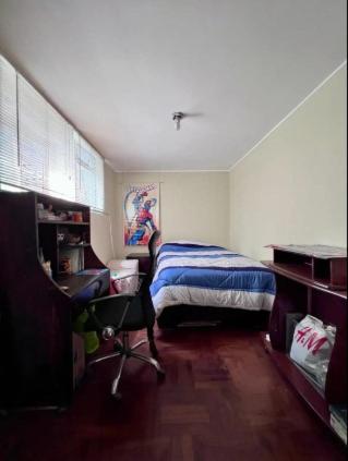 Una cama o camas en una habitación de Siempre Listo
