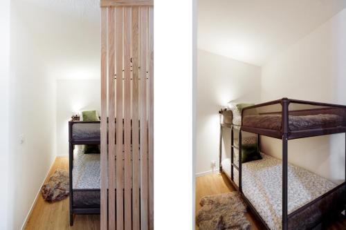 une chambre avec deux lits superposés dans une pièce dans l'établissement Cannes proche Croisette et palais magnifique appartement 4 couchages, à Cannes