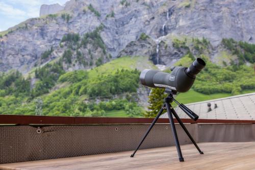 a camera on a tripod in front of a mountain at Lucky Fox in Leukerbad