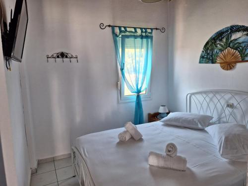 Postel nebo postele na pokoji v ubytování Βig Βlue Apartments