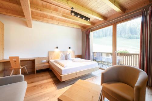 Postel nebo postele na pokoji v ubytování Pure PanoramaHotel Erika Superior
