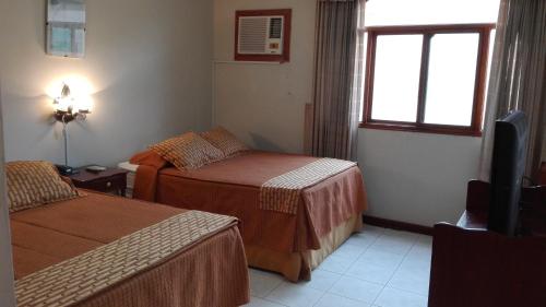 Postel nebo postele na pokoji v ubytování LA SIESTA-Hotel