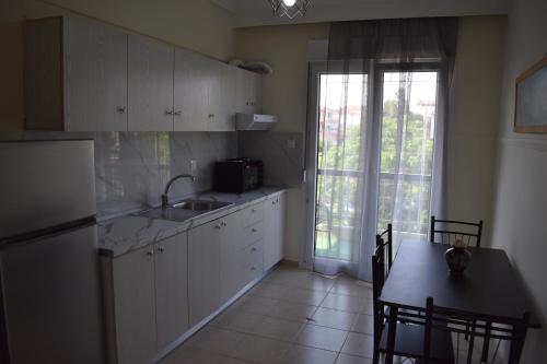 Kuchyň nebo kuchyňský kout v ubytování Absolute Apartment