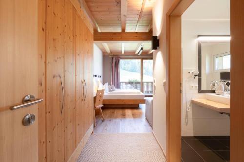 a bathroom with a sink and a toilet in a room at LifestylePanoramaHotel Erika Superior in Neustift im Stubaital