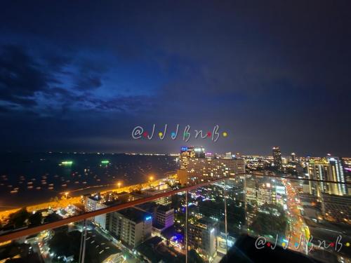 a view of a city at night with lights at Edge Central Pattaya by JJJ in Pattaya Central