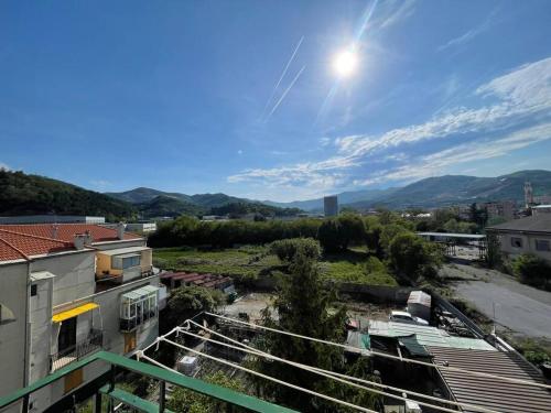 a view of a city from a balcony of a building at Winter in Vado Ligure