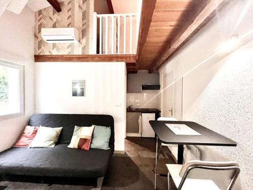 Χώρος καθιστικού στο Studio meublé avec Mezzanine