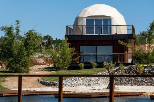 a house with a dome on top of it at Reserva Alecrim EcoSuite & Glamping in Santiago do Cacém