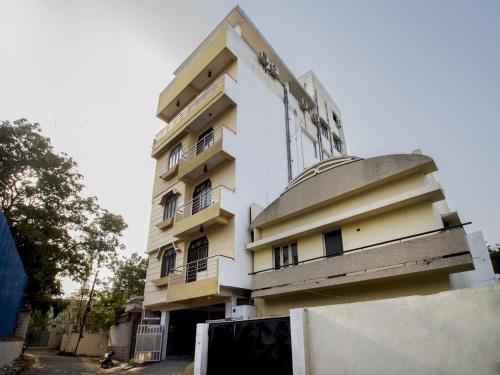 a building with balconies on the side of it at Collection O Hotel Park Heights Banjara Hills Near Gvk One Mall in Hyderabad