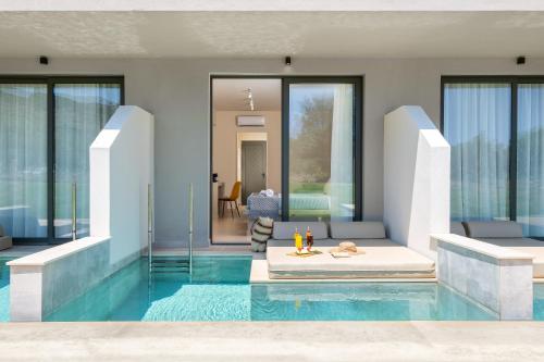 a rendering of a swimming pool with a house at Olive Garden Hotel in Lardos