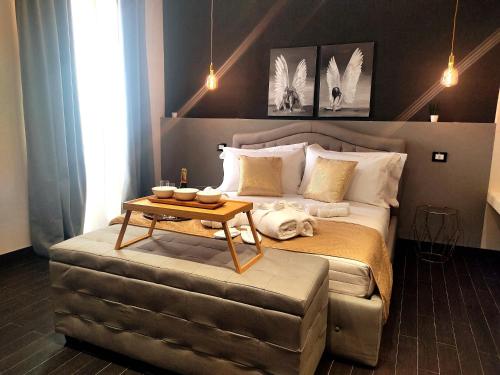 Postel nebo postele na pokoji v ubytování Ti Scialíi Suites Rooms and Relax