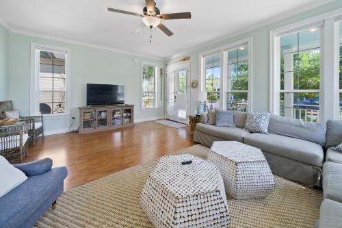 a living room with a couch and a ceiling fan at 30A Rise and Shine in Seagrove Beach