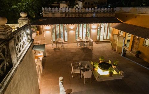 an overhead view of a patio with a table and chairs at The Rawla Narlai - A Luxury Heritage Stay in Leopard Country in Nārlāi