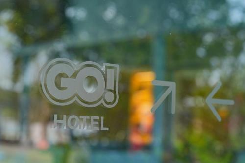 a window with the cot logo on it at GO Hotel Bowin at Robinson Lifestyle Bowin in Si Racha