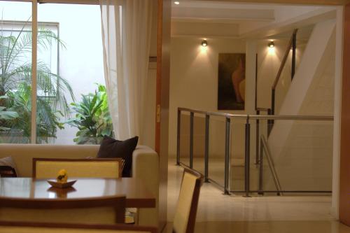 a living room with a couch and a table at Telmho Hotel Boutique in Buenos Aires