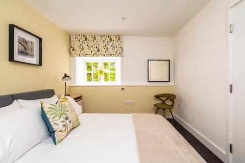 a bedroom with a bed and a window at Central waterside in Oxford