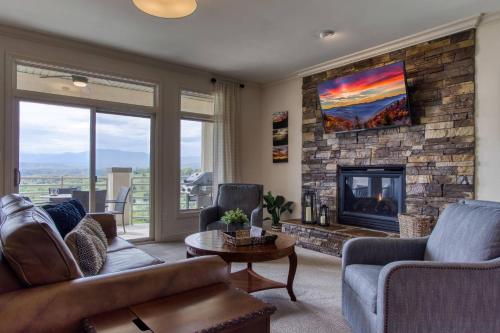 a living room with a couch and a fireplace at Love View in Sevierville