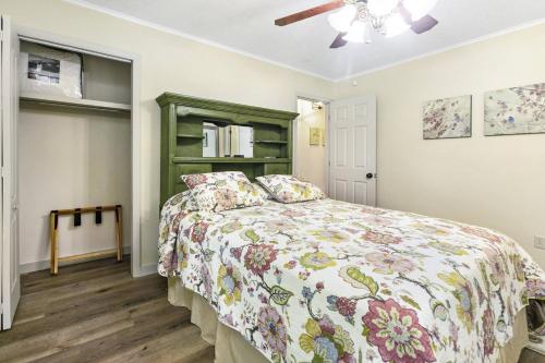 a bedroom with a bed and a ceiling fan at Knot A Kabin in Pigeon Forge