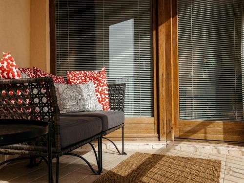 a living room with a chair and a window at Panphilia: Holiday Apartment in Vasto