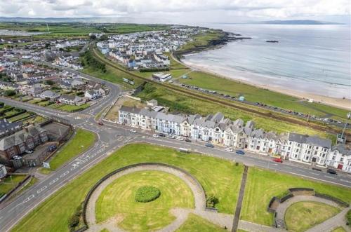 an aerial view of a city and the beach at Portrush By The Sea - 3 Dunluce Park in Portrush