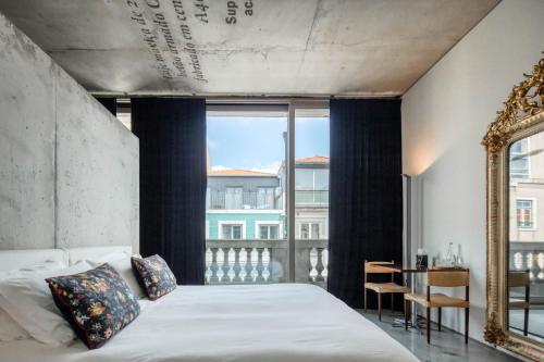 Ένα ή περισσότερα κρεβάτια σε δωμάτιο στο Casa do Conto - Arts & Residence
