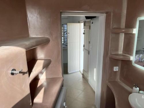 a bathroom with a sink and a toilet in a room at AmatoNostro in Mandrakia