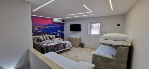 a hospital room with a bed and a tv at Fashion House Napoli in Naples