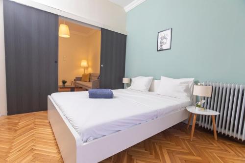 a bedroom with a large white bed in a room at Houseloft Bianca Vision in Thessaloniki