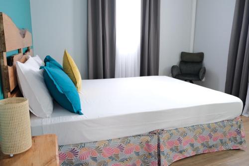 Una cama o camas en una habitación de Résidence Terre et Passion