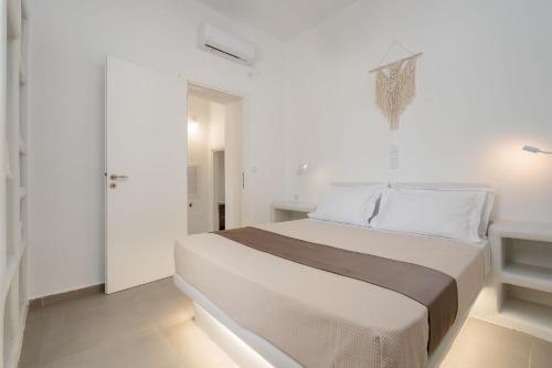 Postel nebo postele na pokoji v ubytování Bee Naxian House