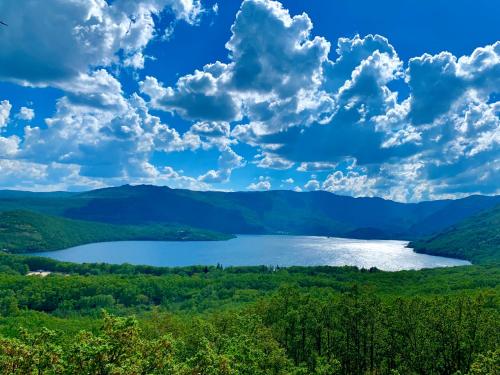 a view of a lake in the mountains at Hostal La Trucha Sanabria in Puebla de Sanabria