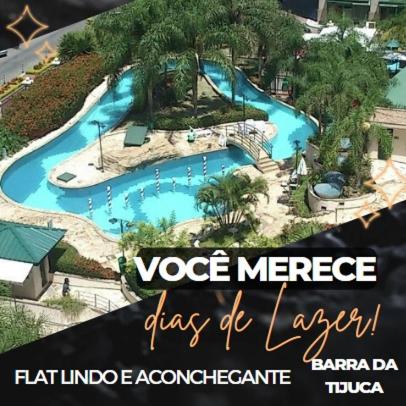 a view of a large pool at a resort at Barra da Tijuca - 508 - De Frente para Maravilhosa Piscina - Estacionamento Gratuito - Academia Comphania Atletica - Balsa para Praia Grátis - Microondas - Geladeira Grande - Recepção 24horas - Wi-Fi - Com Pia in Barra da Tijuca