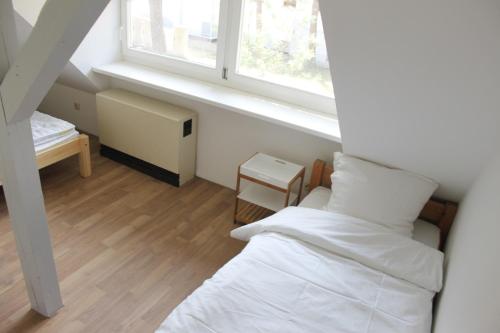 Katil atau katil-katil dalam bilik di Inselglück unter Reet 100m zum Strand - Garten & Privatterrasse - Hund willkommen