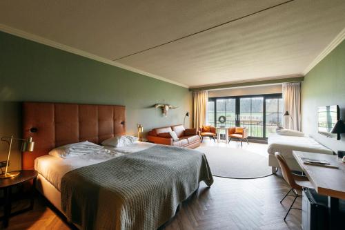Letto o letti in una camera di Van der Valk Hotel Apeldoorn - de Cantharel