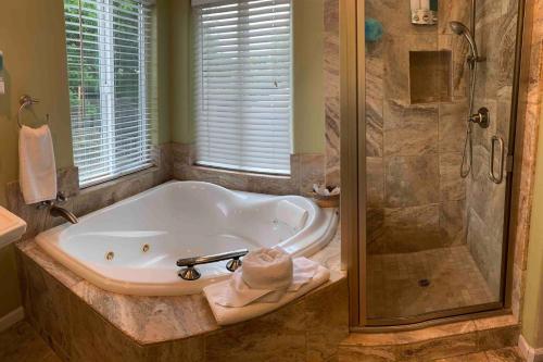 a large bathroom with a tub and a shower at Cozy Guesthouse- Individual Unit Private & Relaxing in Concord