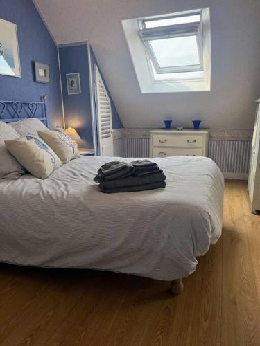Katil atau katil-katil dalam bilik di Maison conviviale 8 personnes, vue mer, animaux acceptés