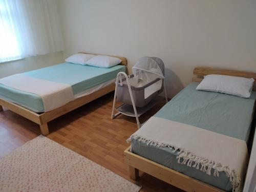Ліжко або ліжка в номері KAZDAL SUİTE