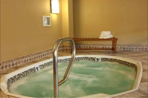 a jacuzzi tub in a hotel room at Stay Together Suites on The Strip - 1 Bedroom Suite 1012 in Las Vegas