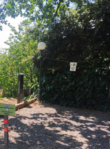 a large green hedge with a sign on it at Agriturismo Il Poggiarello in Siena