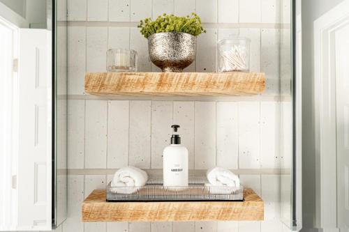 a bathroom with a shelf with a bottle of soap at Modern Industrial Loft - Center of RiNo Art District in Denver